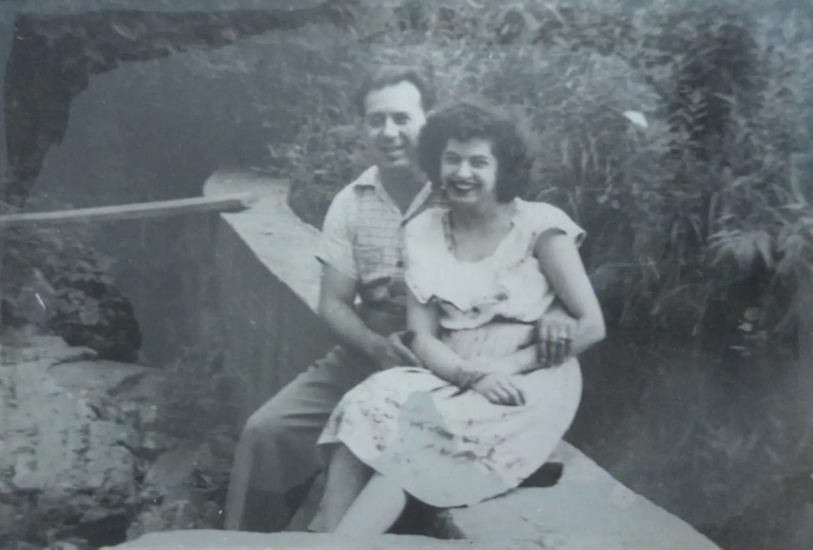 Anthony and Carmela Falvo, Greg and Gerry's parents, seated together outdoors